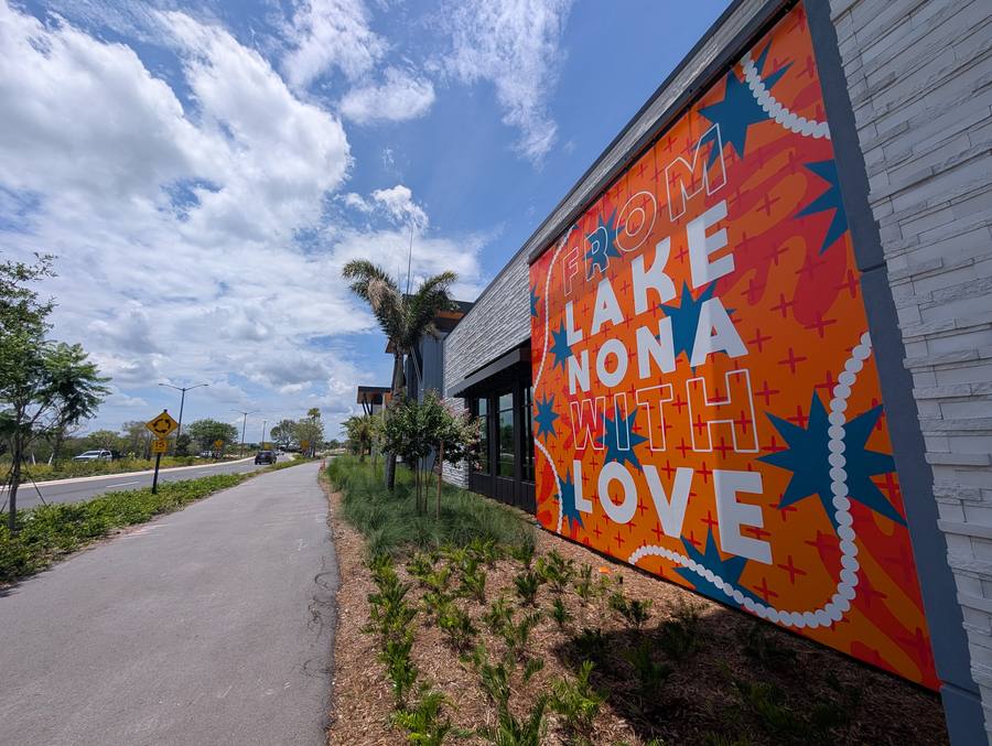 Lake Nona mural reading 'From Lake Nona With Love' along the community trail